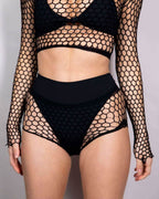 Black fishnet rave bodysuit two piece set with long sleeves and high waisted shorts for festival outfits