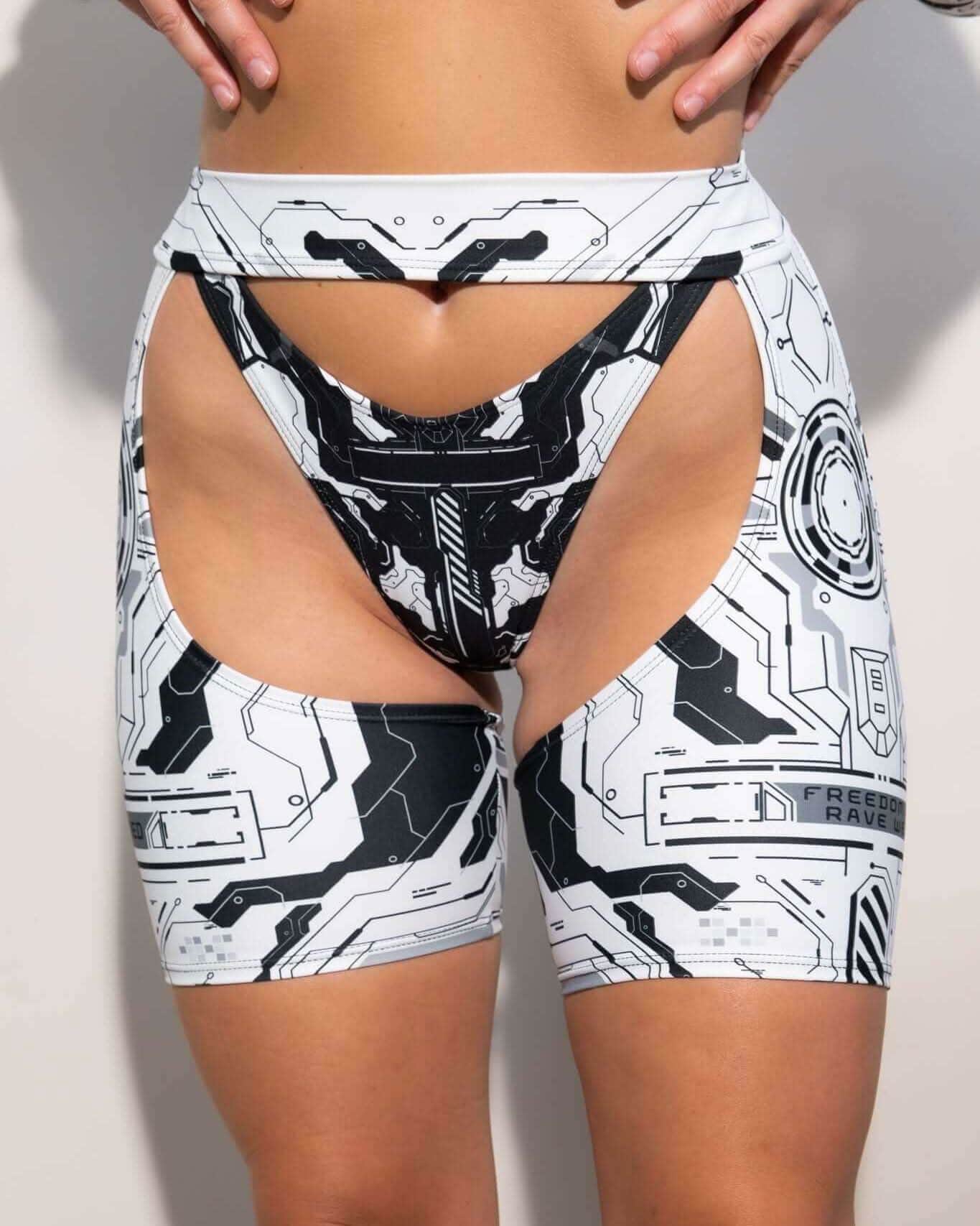 White Mechanoid chaps with black circuit print styled as rave bodysuit alternative for festival outfits