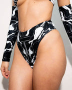 Black Mechanoid rave pants thong back view with geometric print and high waisted cut for festival outfits