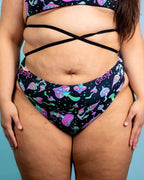 Rave pants style high waisted mushies print festival bottoms with strappy waist detail front view
