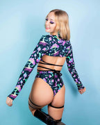 Mushies high waisted Brazilian rave pants back view showing cheeky fit and strappy leg details on model