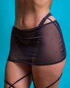 Black mesh rave skirt back view with strappy details for festival outfits and rave wear