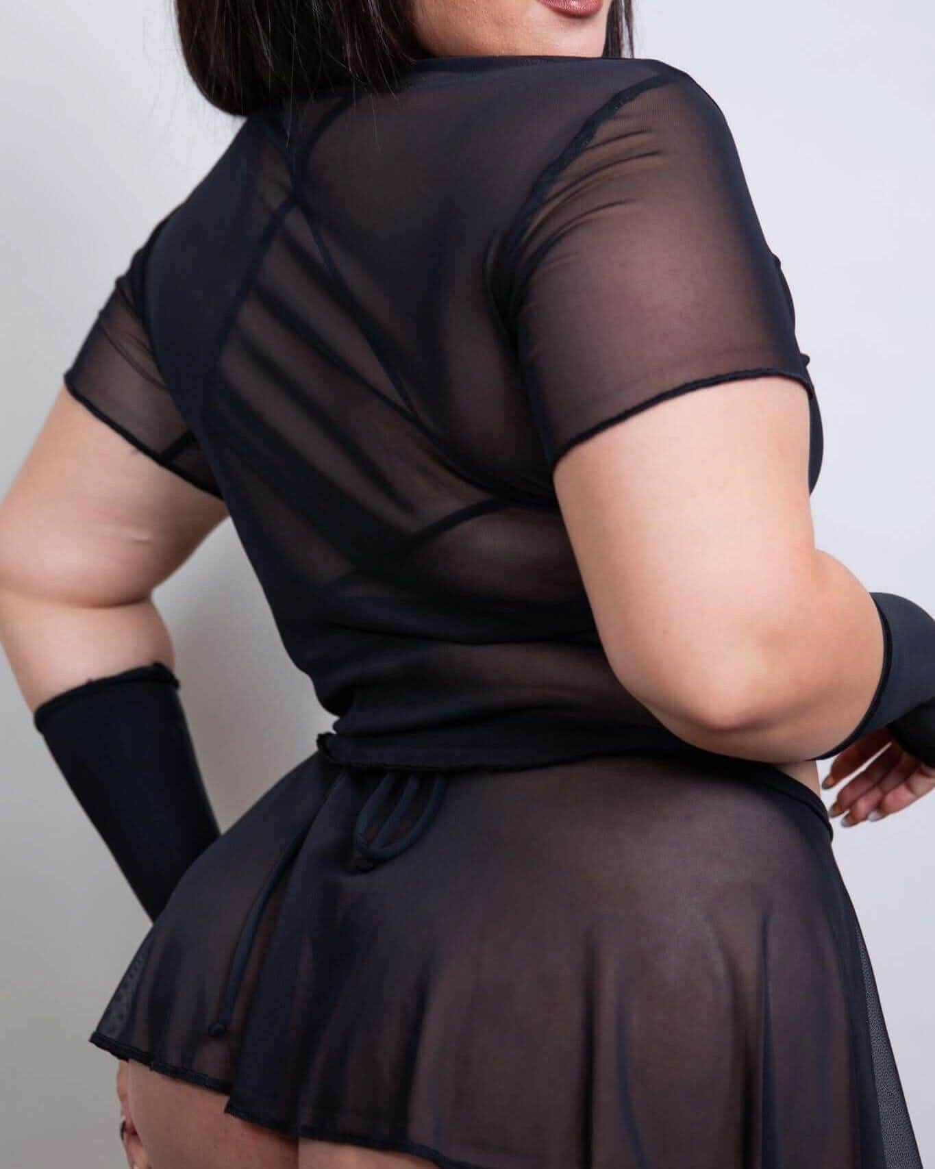 Black mesh rave top shown from back view with model wearing matching arm warmers on white background