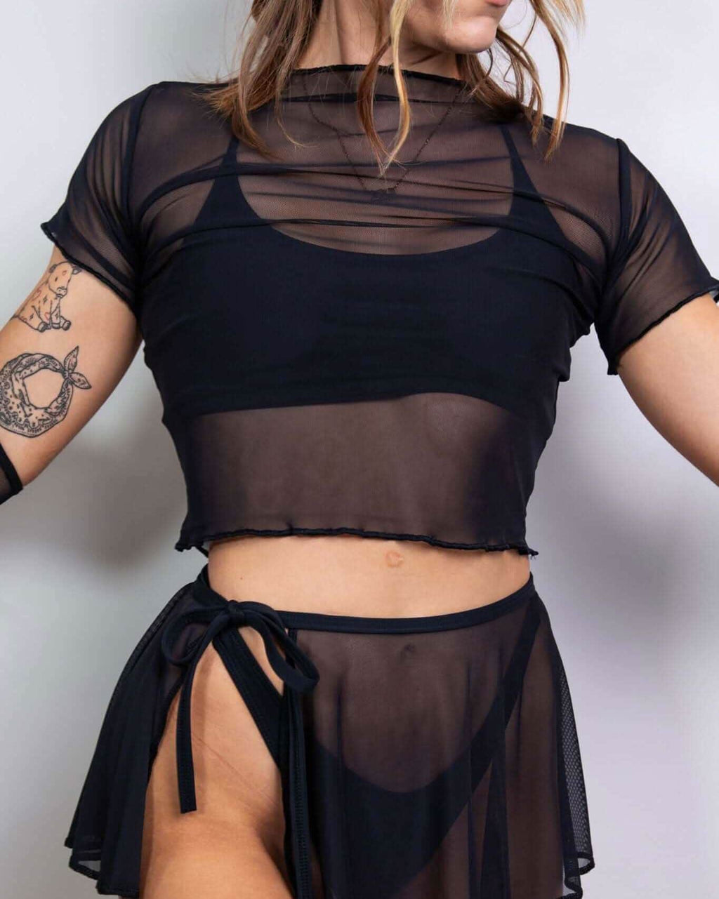 Black mesh rave top two-piece set with crop tee and mini skirt for festival outfits