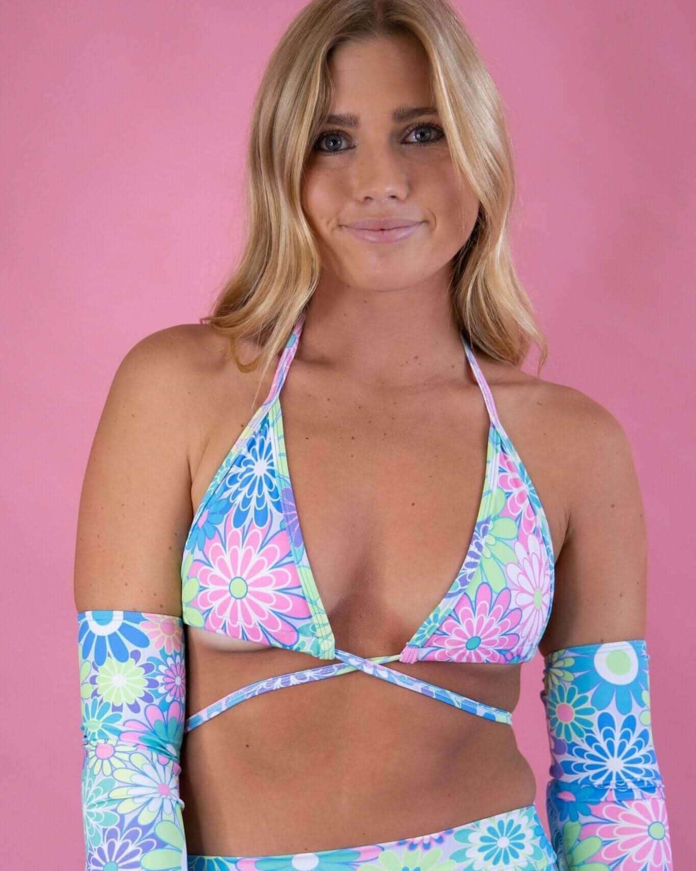Retro Bloom Wrap Bikini Top featuring pastel groovy flower print, perfect for summer and rave outfits.