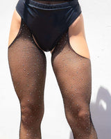 Black rhinestone fishnet stockings with garter detail, perfect for rave outfits and stylish fashion statements.