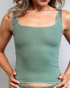 Woman modeling a soft sea spray ribbed lounge tank top, perfect for comfortable, relaxed afternoons. Great for rave outfits.