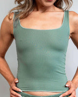 Woman modeling a soft sea spray ribbed lounge tank top, perfect for comfortable, relaxed afternoons. Great for rave outfits.