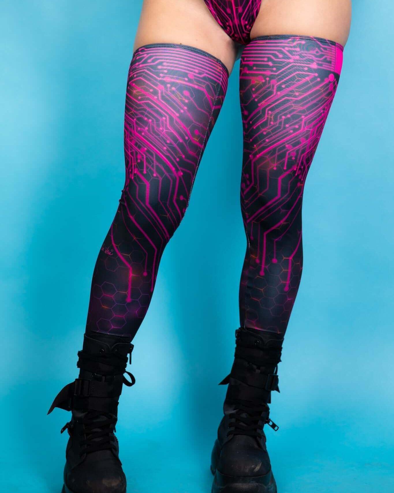 Pink Singularity leg sleeves featuring a circuit design, perfect for rave outfits and festival style.