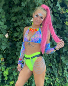 Model wearing vibrant rave outfit with neon accents and accessories, perfect for festivals and special events.