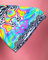 Colorful Technicolor Festival Scarf for rave outfits, featuring vibrant patterns on lightweight fabric.
