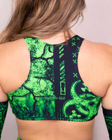 Back view of the green and black Toxic Teaser Top featuring unique designs, perfect for rave outfits.