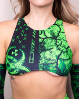 Model wearing green and black Toxic Teaser Top, featuring bold designs, perfect for rave outfits and eco-friendly fashion.