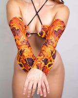 Volcanic arm sleeves in vibrant orange and black, perfect for rave outfits and festival fashion.