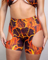 Volcanic biker shorts with cut-outs, perfect for rave outfits and active wear, showcasing vibrant orange and black design.