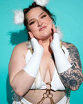 Model wearing White Eco-Luxe Gloves, showcasing a rave outfit with a playful, stylish vibe against a vibrant backdrop.