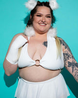 Model wearing a White Eco-Luxe O-Ring Halter Top with furry accents, perfect for summer rave outfits and beach days.