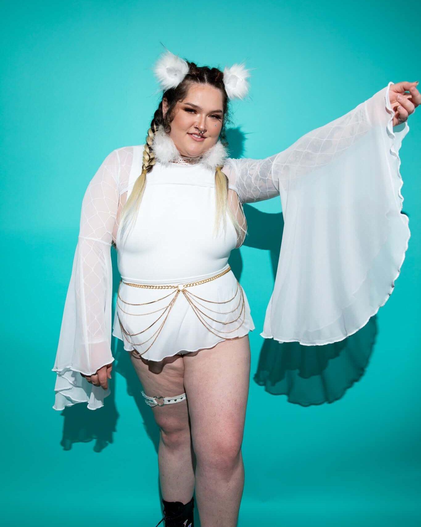 Model showcasing lightweight white mesh bell sleeves with a fitted bodysuit, perfect for rave outfits.