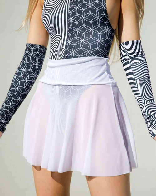 White mesh skater skirt paired with a stylish patterned bodysuit, perfect for playful outfits and rave fashion.